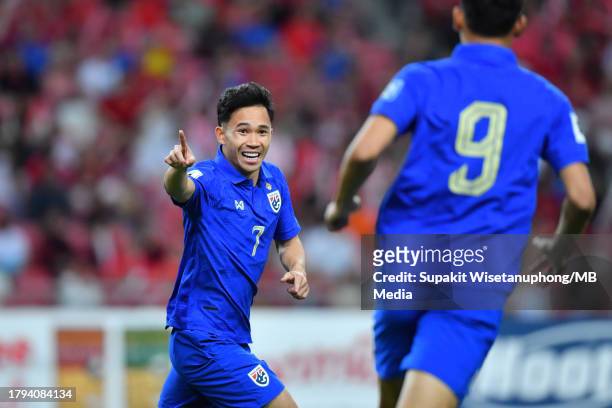 Supachok Sarachat of Thailand celebrates after scoring his side's first goal during the FIFA World Cup Asian 2nd qualifier match between Singapore...