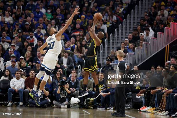 Chris Paul of the Golden State Warriors shoots over Rudy Gobert of the Minnesota Timberwolves at Chase Center on November 14, 2023 in San Francisco,...