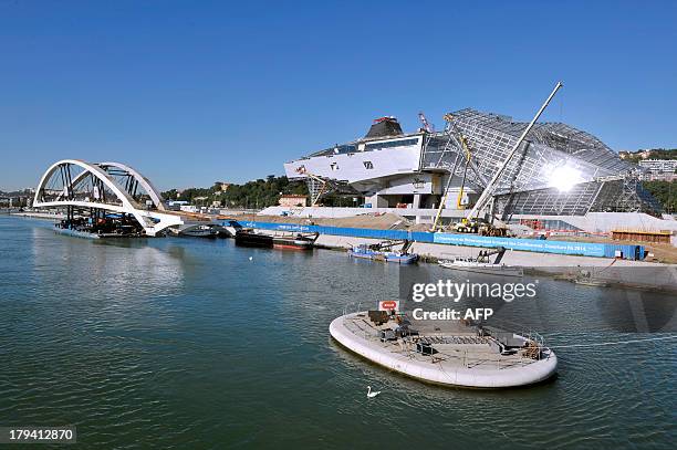 The new Raymond Barre bridge is placed outside the new Confluences Museum in Lyon, southeastern France, on September 3, 2013. AFP PHOTO / ROMAIN...