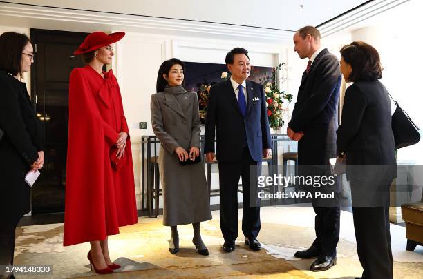 Prince William, Prince of Wales and Catherine, Princess of Wales talk with South Korea's President Yoon Suk Yeol and his wife Kim Keon Hee at a hotel...