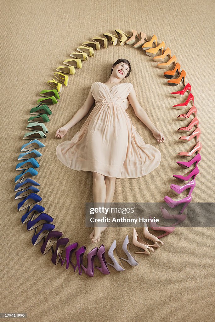 Woman with rainbow coloured shoes in oval shape