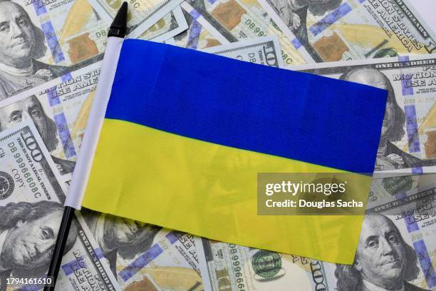 ukraine flag on money in us currency - dollar stock pictures, royalty-free photos & images