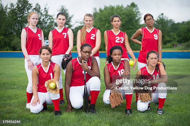 portrait of girls' high school softball team - softball sport stock pictures, royalty-free photos & images