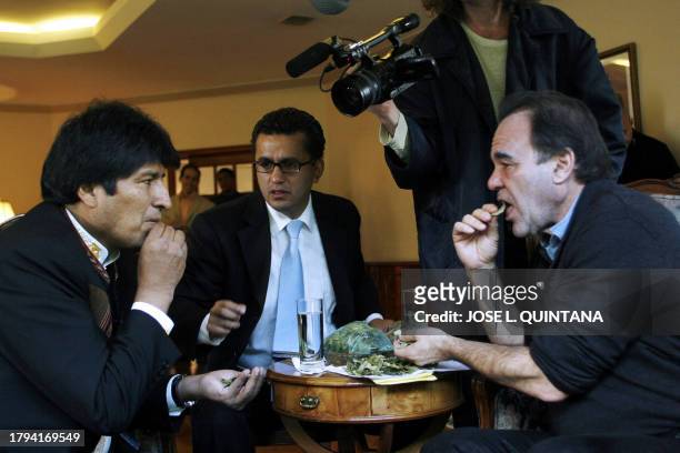 Bolivian President Evo Morales Ayma chews coca leaves with US film director Oliver Stone , at the Presidential Palace in La Paz on January 13, 2009....