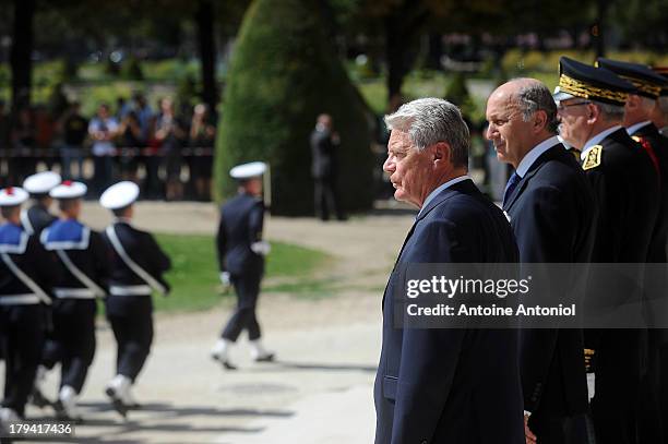 German President Joachim Gauck receives the military honours by French Foreign Minister Laurent Fabius during a welcoming ceremony on September 3,...