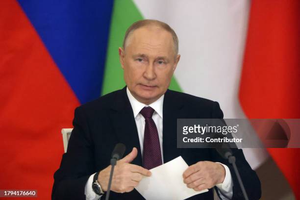 Russian President Vladimir Putin holds his papers during Russian-Tajik talks at the Grand Kremlin Palace, on November 21, 2023 in Moscow, Russia....