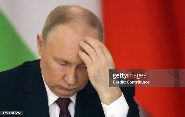 Russian President Vladimir Putin grimases during Russian-Tajik talks at the Grand Kremlin Palace, on November 21, 2023 in Moscow, Russia. President...