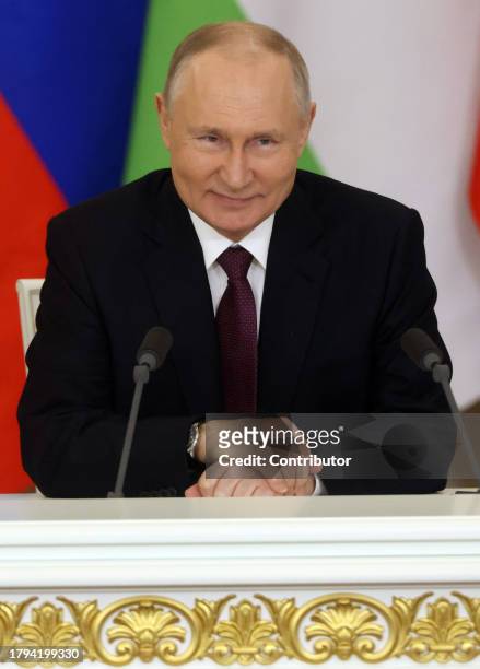 Russian President Vladimir Putin smiles during Russian-Tajik talks at the Grand Kremlin Palace, on November 21, 2023 in Moscow, Russia. President of...