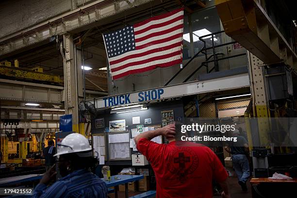 Workers take a break at the Metropolitan Transportation Authority overhaul shop in Coney Island, New York, U.S., on Thursday, Aug. 29, 2013. New...