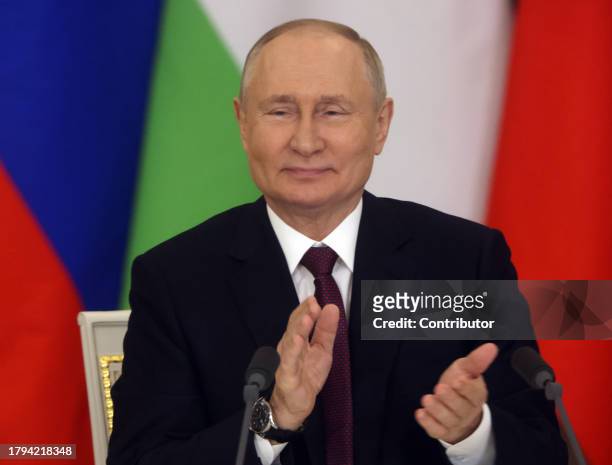 Russian President Vladimir Putin applauds during Russian-Tajik talks at the Grand Kremlin Palace, on November 21, 2023 in Moscow, Russia. President...