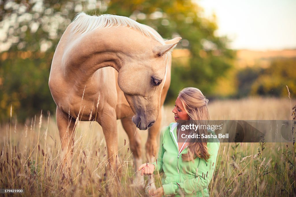 Woman Sitting Down with Horse