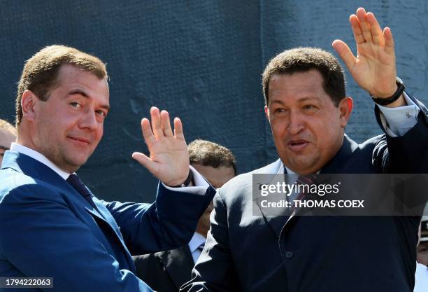 Venezuelan President Hugo Chavez and his Russian counterpart Dmitry Medvedev wave from the deck of the Udaloy-class anti-submarine vessel Admiral...