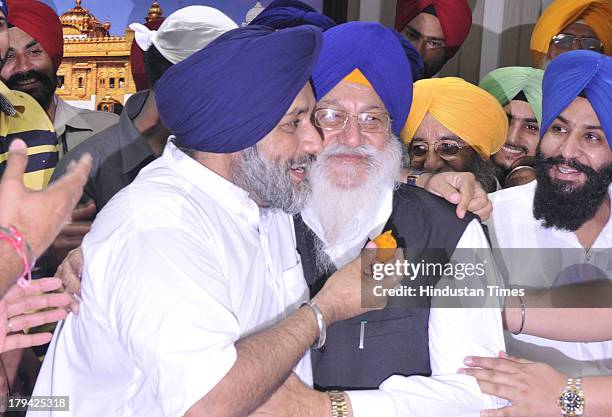 President Avtar Singh Makkar being hugged by the reelected party President Sukhbir Singh Badal after election at Teja Singh Samundri Hall on...