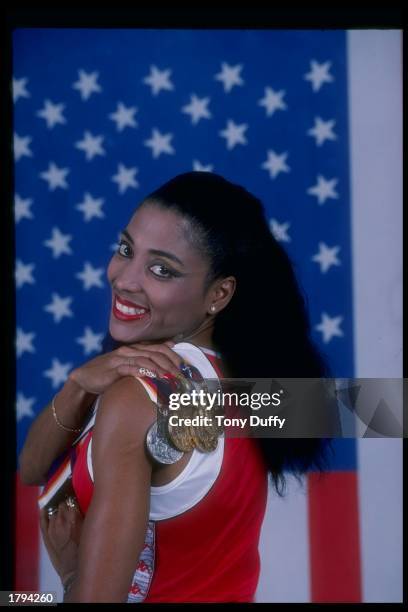 Sprinter Florence Griffith-Joyner poses for a portrait with her medals, won at the 1988 Olympic Games in Seoul, South Korea.
