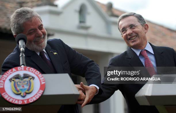 Brazilian President Luiz Inacio Lula da Silva jokes around with his Colombian counterpart Alvaro Uribe at the presidential ranch, Hato Grande, in the...