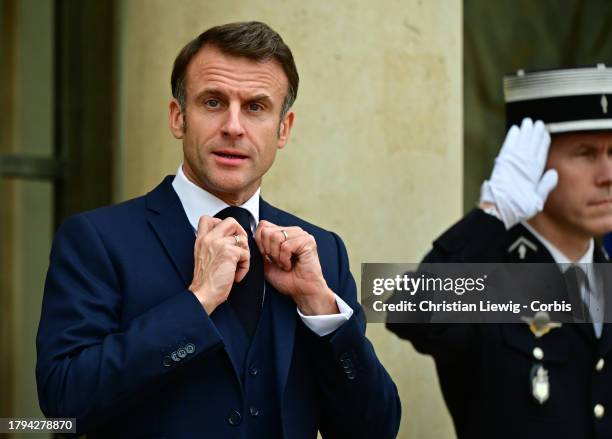 French President Emmanuel Macron prior to a lunch with Ivory Coast President Alassane Ouattara at the Elysee Palace on November 21, 2023 in Paris,...