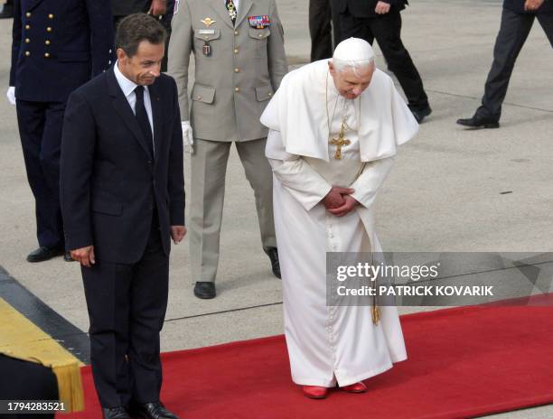 French President Nicolas Sarkozy welcomes Pope Benedict XVI upon his arrival at Orly airport, south of Paris, on September 12, 2008 for his first...