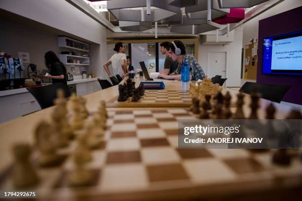 Employees work at Mila Quebec AI Institute on July 4 in Montreal, Canada. Mila is a not-for-profit organization whose Scientific Director, Yoshua...