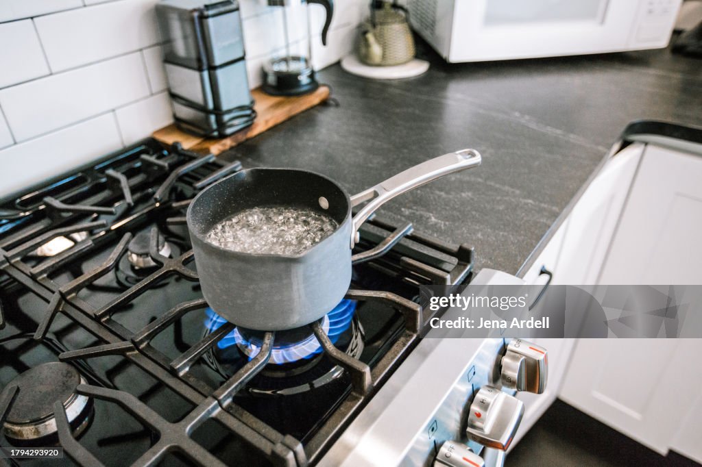 Boiling Water on Stovetop, Gas Stove Burner in Kitchen, Methane Natural Gas