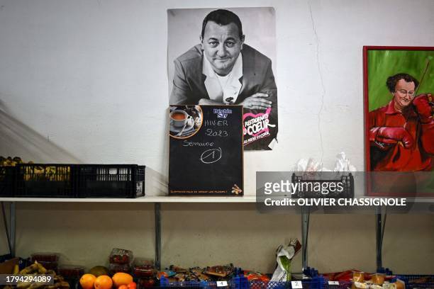 Picture taken on November 21, 2023 in Grenoble shows a portrait of late humorist Michel Colucci best known as "Coluche" at a facility of French...