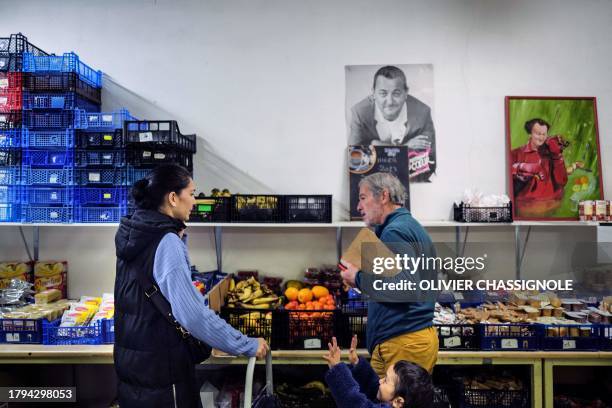Picture taken on November 21, 2023 in Grenoble shows a portrait of late humorist Michel Colucci best known as "Coluche" at a facility of French...