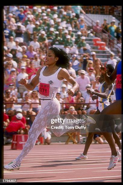 Florence Griffith-Joyner runs down the track during the Olympic Trials.