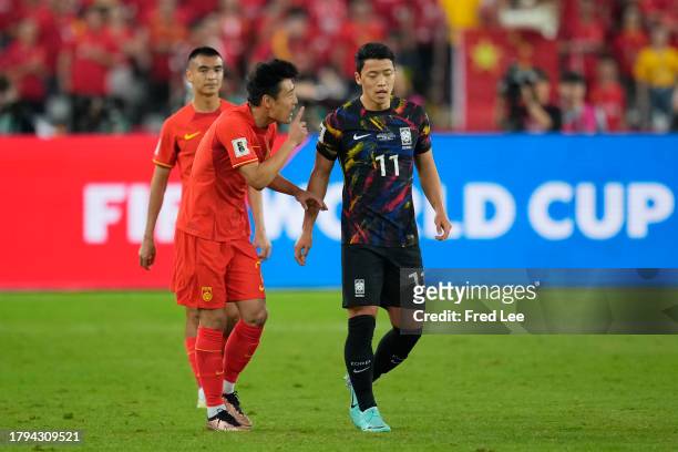 Hwang Hee-chan of South Korea and Wu lei of China react during the 2026 FIFA World Cup Qualifier second round Group C match between China and South...