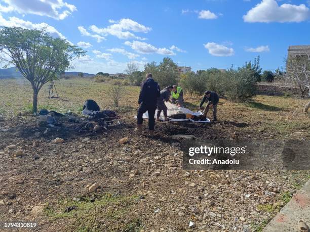 Officials carry the dead bodies after it was stated that 3 people, including 2 journalists, killed in the Israeli air strike on the south of Lebanon...