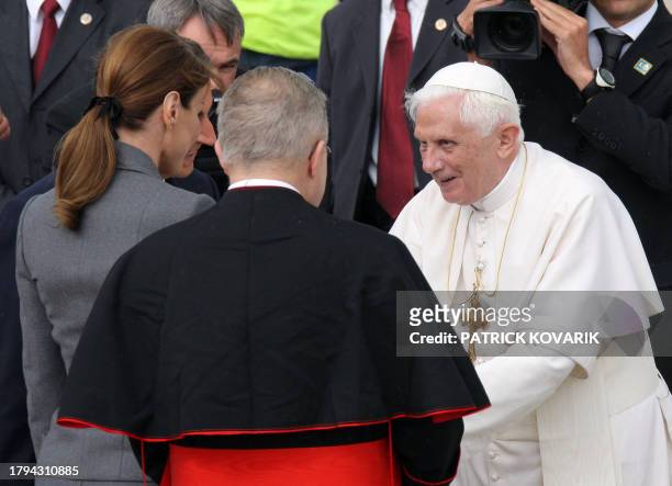 Pope Benedict XVI is welcomed by French President Nicolas Sarkozy , his wife Carla Bruni-Sarkozy and archbishop Andre Vingt-Trois upon his arrival at...