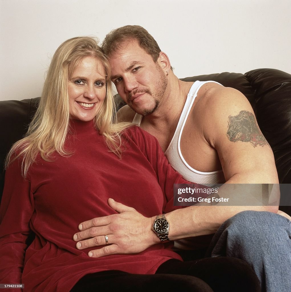 Portrait of former heavyweight Tommy Morrison posing with his wife