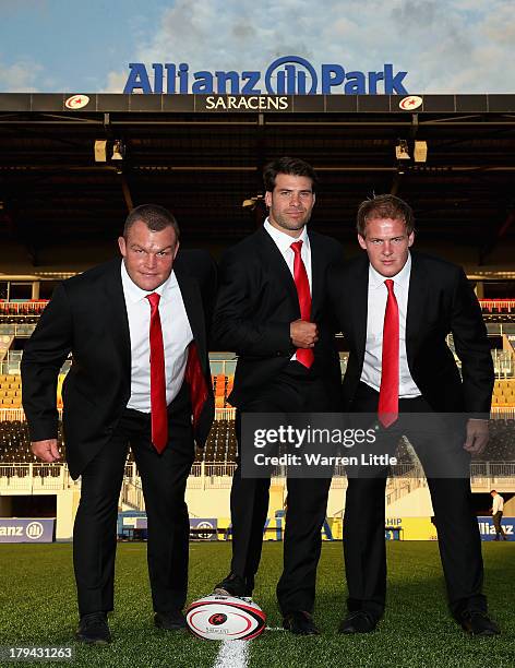 Matt Stevens, Schalk Britz and Rhys Gill of Saracens pose with their new Apsley taylored suits during the season launch at Allianz Park on September...