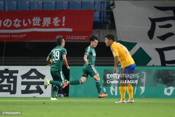 Yuzo Iwakami of Matsumoto Yamaga celebrates with teammate Yoshiro Abe after scoring his team's first goal during the J.League J1 second stage match...
