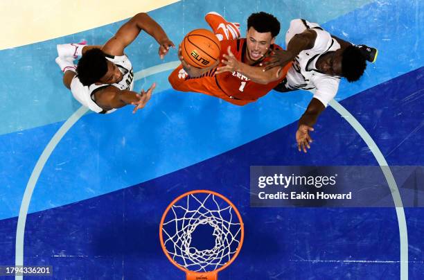Chase Hunter of the Clemson Tigers attempts a basket against Barry Dunning Jr. #22 and Efrem Johnson of the UAB Blazers in the first half at Harrah's...