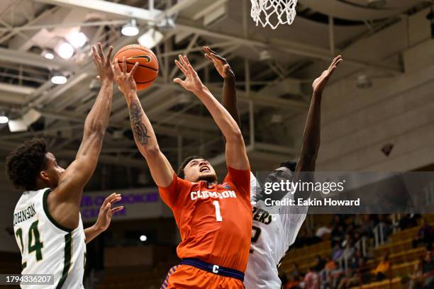 Chase Hunter of the Clemson Tigers attempts a basket against Barry Dunning Jr. #22 and Efrem Johnson of the UAB Blazers in the first half at Harrah's...