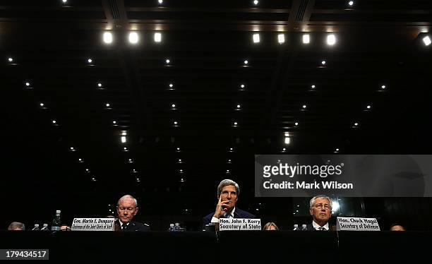 Chairman of the Joint Chiefs of Staff Gen. Martin Dempsey, U.S. Secretary of State John Kerry, and U.S. Defense Secretary Chuck Hagel testify before...
