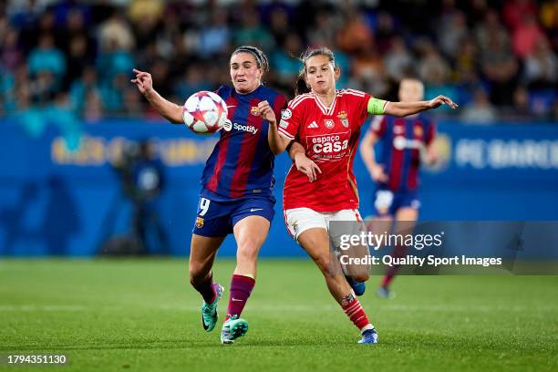 Mariona Caldentey of FC Barcelona competes for the ball with Andreia Faria of SL Benfica during the UEFA Women's Champions League group stage match...