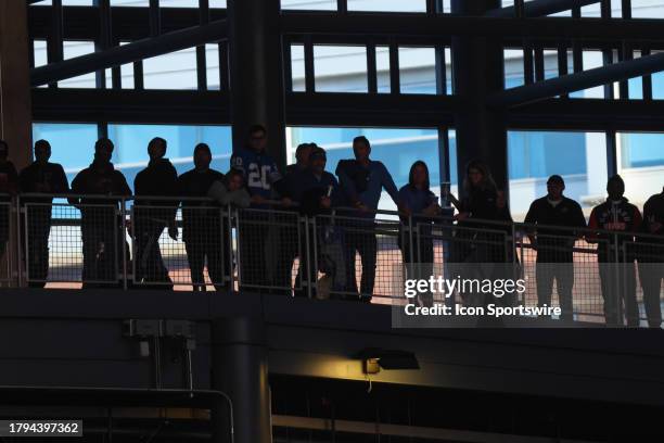 Fans watch the game from the concourse level of the stadium during an NFL football game between the Chicago Bears and the Detroit Lions on November...