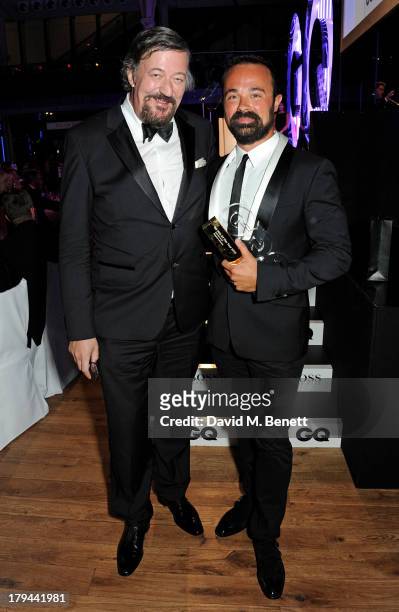 Stephen Fry and Evgeny Lebedev, winner of the Best Entrepreneur award, attend the GQ Men of the Year awards at The Royal Opera House on September 3,...