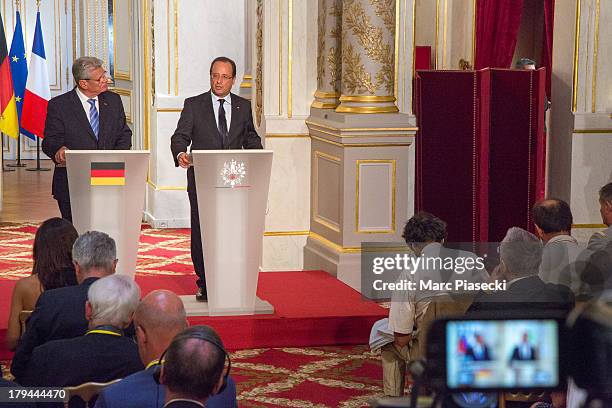 French president Francois Hollande and German President Joachim Gauck attend a press conference at the Elysee Palace on September 3, 2013 in Paris,...