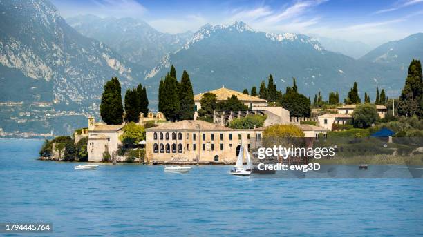holidays in italy - scenic view of the tourist village of san vigilio on lake garda - lombard stock pictures, royalty-free photos & images