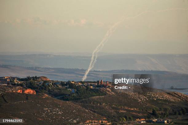 Picture taken from southern Lebanon near the eastern border with Israel shows rockets being fired by the Hezbollah group towards Israel on November...