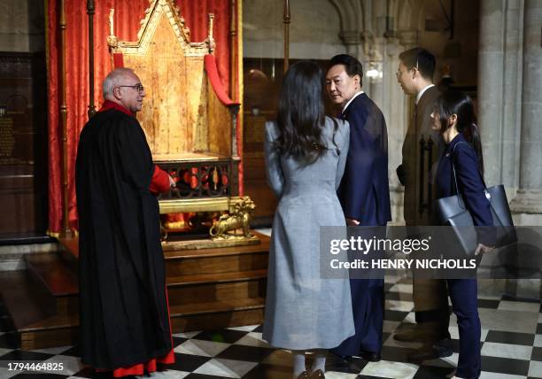 South Korea's President Yoon Suk Yeol and his wife Kim Keon Hee are shown The Coronation Chair, also known as St Edward's Chair, during their visit...