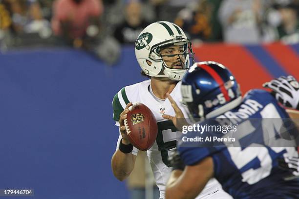 Quarterback Mark Sanchez of the New York Jets passes the ball against the New York Giants at MetLife Stadium on August 24, 2013 in East Rutherford,...