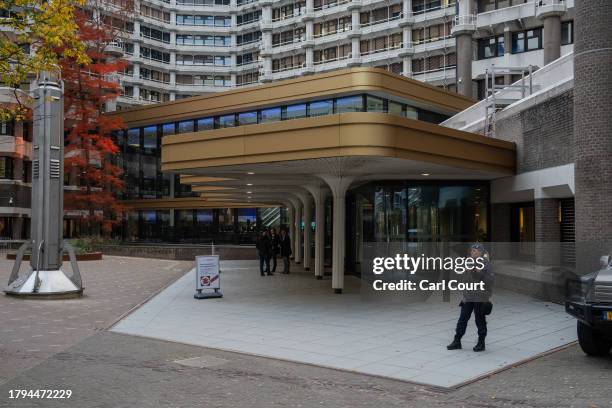 Police officers stand guard outside the Statenpassage building ahead of a televised debate between Dutch party leaders, the last before tomorrow's...