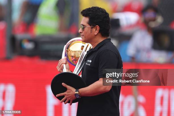 Goodwill Ambassador, Sachin Tendulkar walks out onto the field while holding the ICC Men's Cricket World Cup Trophy onto the pitch prior to the ICC...