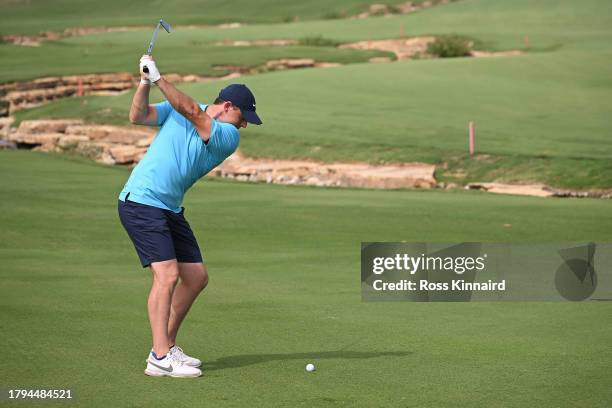 Rory McIlroy of Northern Ireland plays a shot on the 18th hole during a practice round prior to the DP World Tour Championship on the Earth Course at...