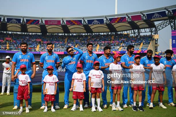 Players of India line up for national anthems prior to the ICC Men's Cricket World Cup India 2023 Semi Final match between India and New Zealand at...