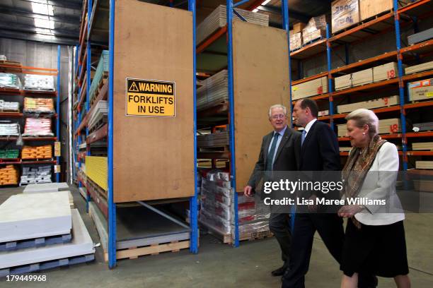 Australian Opposition Leader, Tony Abbott, Bronwyn Bishop and Liberal candidate Dr Michael Feneley tour a hardware store on September 4, 2013 in...
