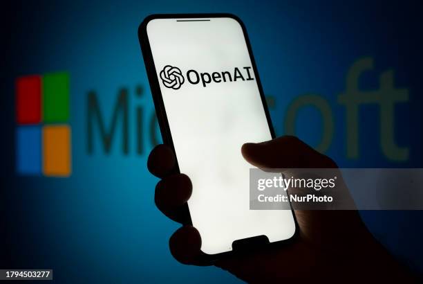 The Microsoft and OpenAI logos are seen on screens in this illustration photo in Warsaw, Poland on 21 November, 2023. Former head of OpenAI Sam...