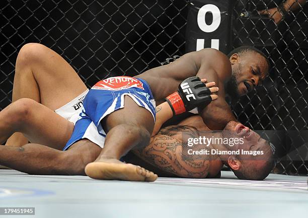 Papi Abedi elbows Dylan Andrews while the two wrestle not he canvas during a middleweight bout during UFC Fight Night 27 Condit v Kampmann 2 at...